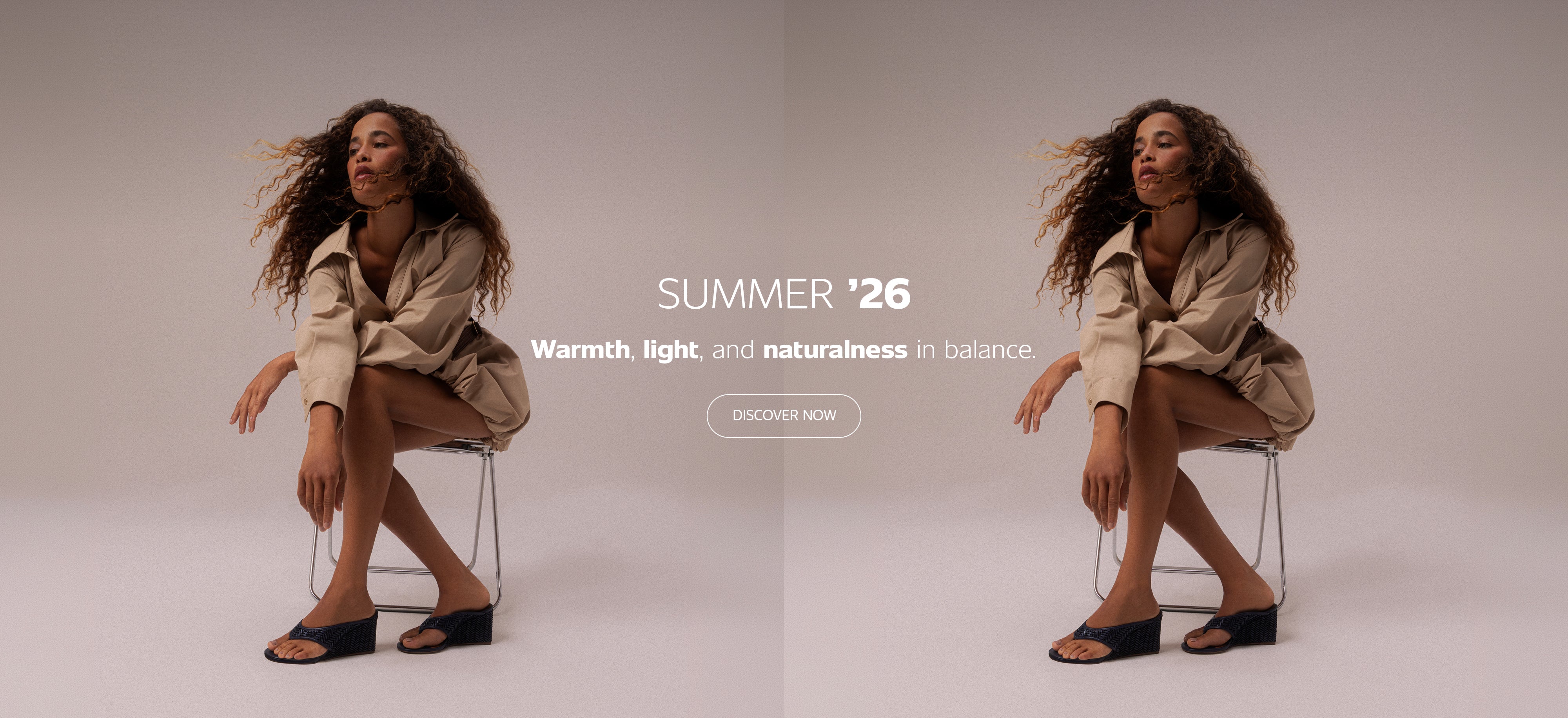 Split banner showing a woman seated on a chair wearing black wedge sandals and a beige outfit on both sides, with centered text “Summer ’26 – Warmth, light, and naturalness in balance” and a “Discover Now” button.