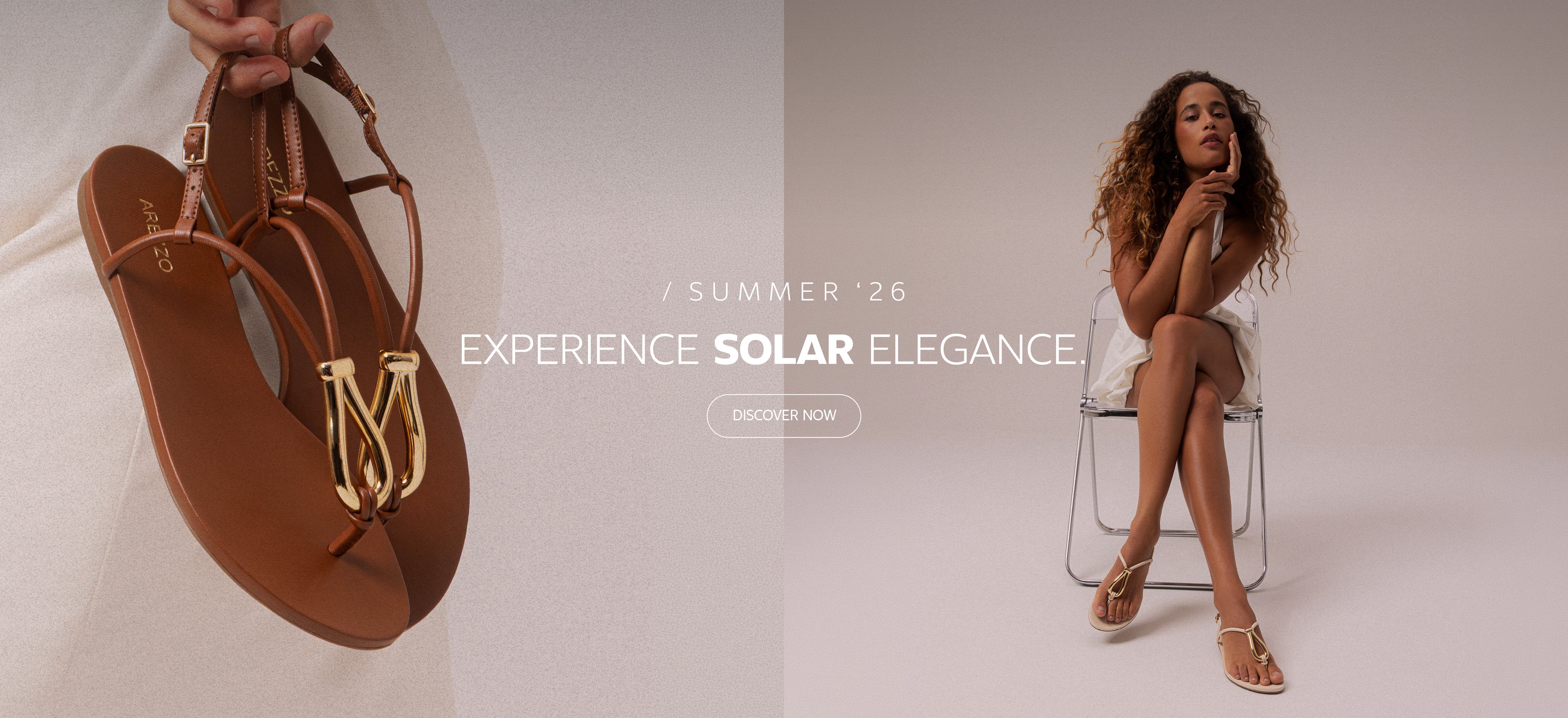 Summer ’26 campaign banner featuring brown leather sandals with gold metallic detail on the left and a seated model wearing white on the right, with the headline “Experience Solar Elegance” and a “Discover Now” CTA in the center.