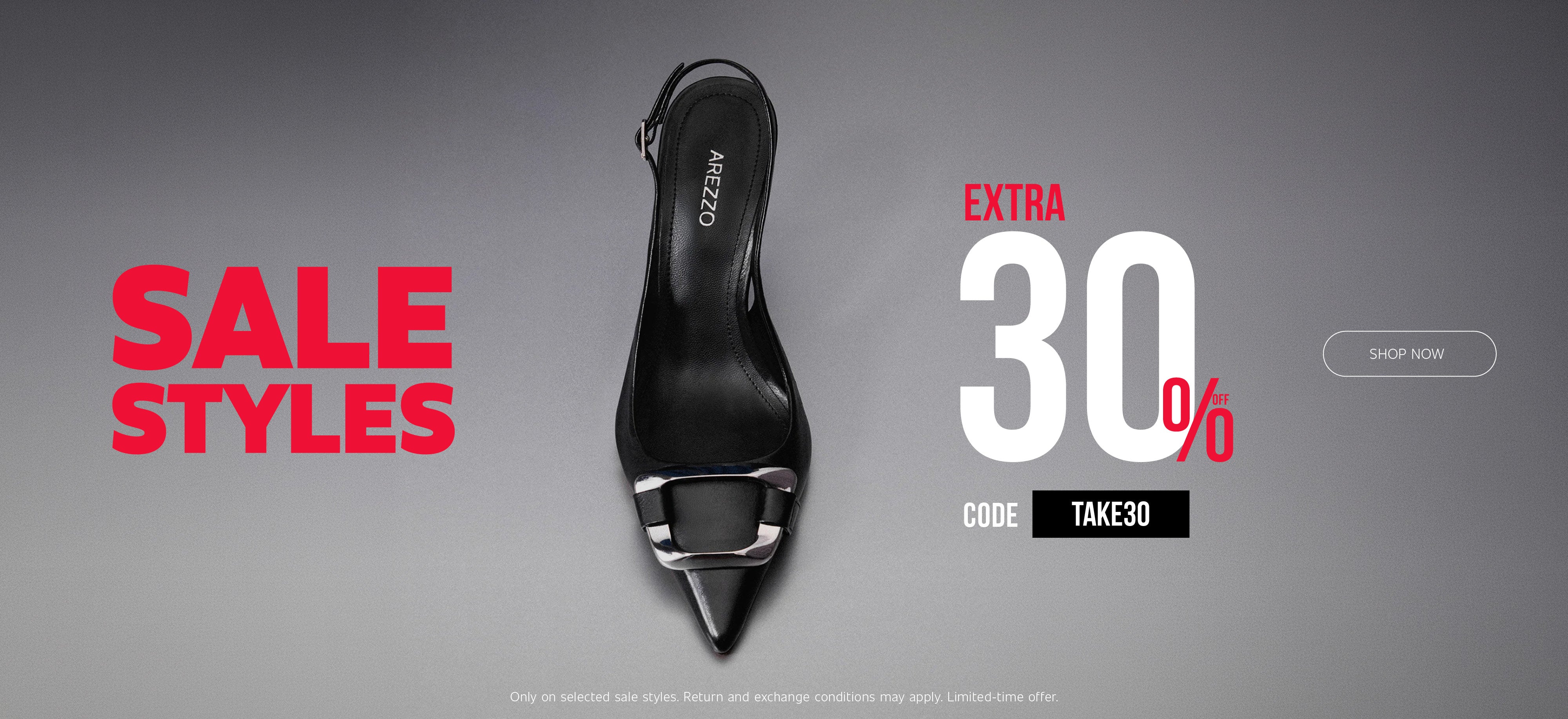 Black pointed-toe slingback pump with a silver metallic buckle detail centered on a gray background. Large red text reads “SALE STYLES,” while white and red text promotes “EXTRA 30% OFF” with code “TAKE30.” A “SHOP NOW” button appears on the right, and fine print at the bottom reads “Only on selected sale styles. Return and exchange conditions may apply. Limited-time offer.”