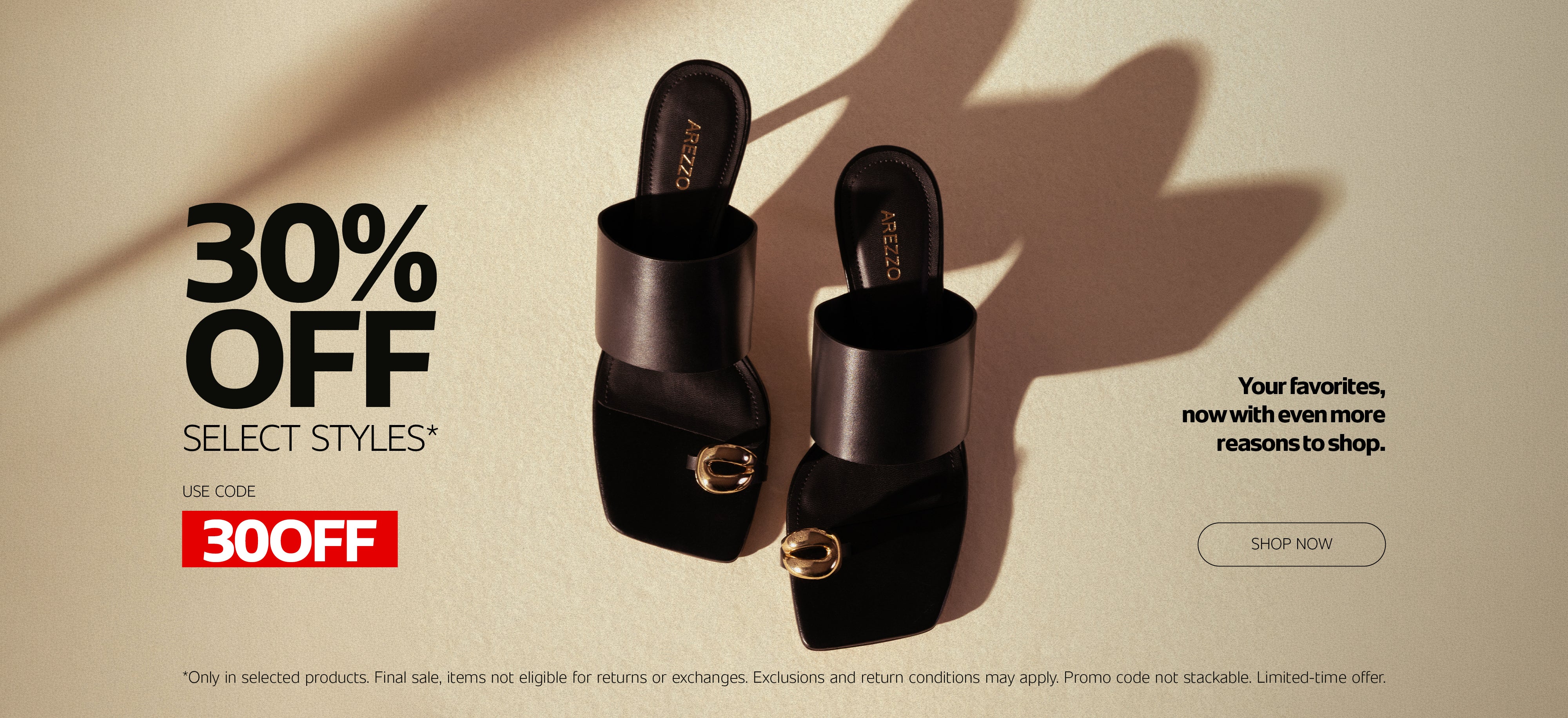 Black Arezzo slide sandals displayed in a minimalist fashion campaign with soft shadows and neutral background.