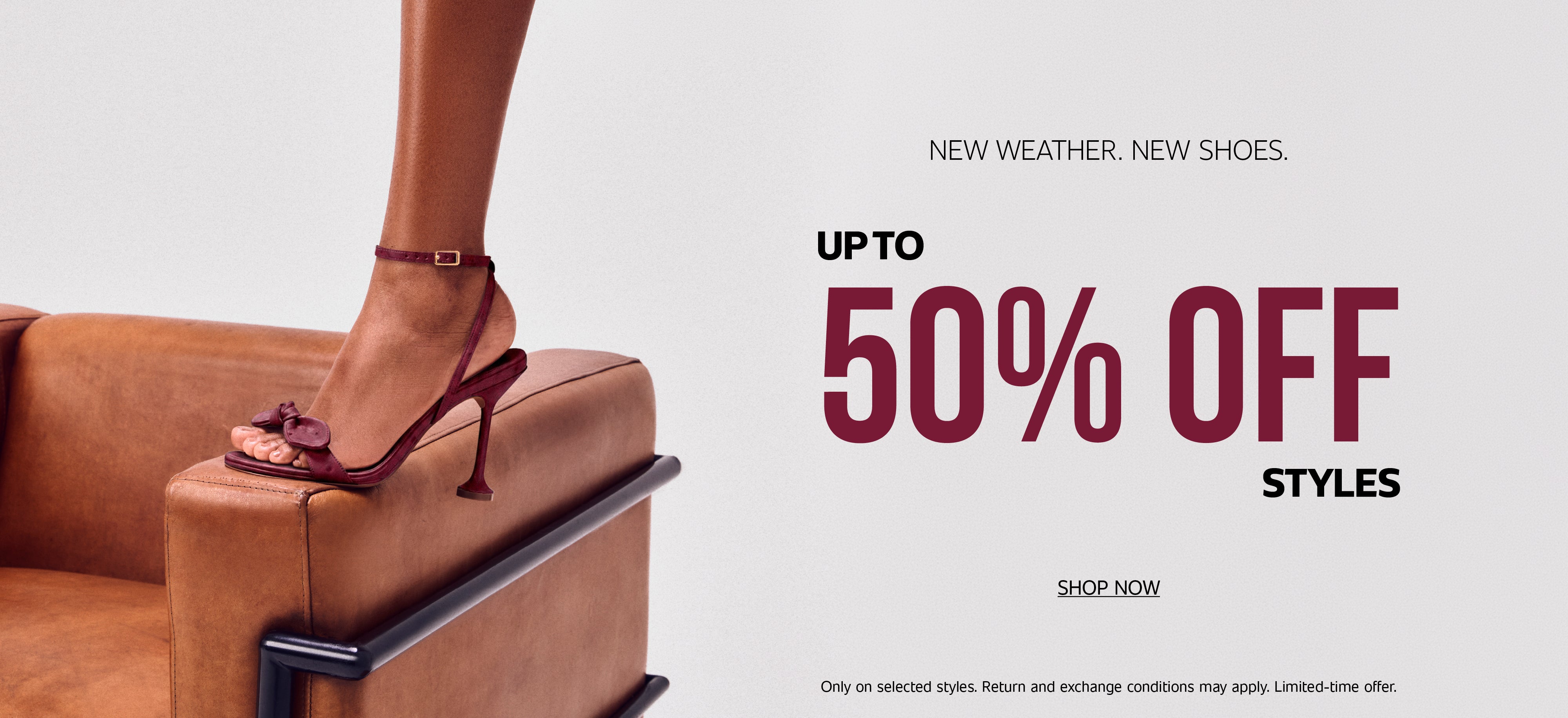 Promotional banner with the text "NEW WEATHER. NEW SHOES." and "UP TO 50% OFF STYLES" in bold burgundy letters. On the left, a model's foot wearing a burgundy strappy high-heeled sandal rests on the armrest of a brown leather armchair. Below the text, there is a "SHOP NOW" call-to-action button, along with fine print detailing offer terms.