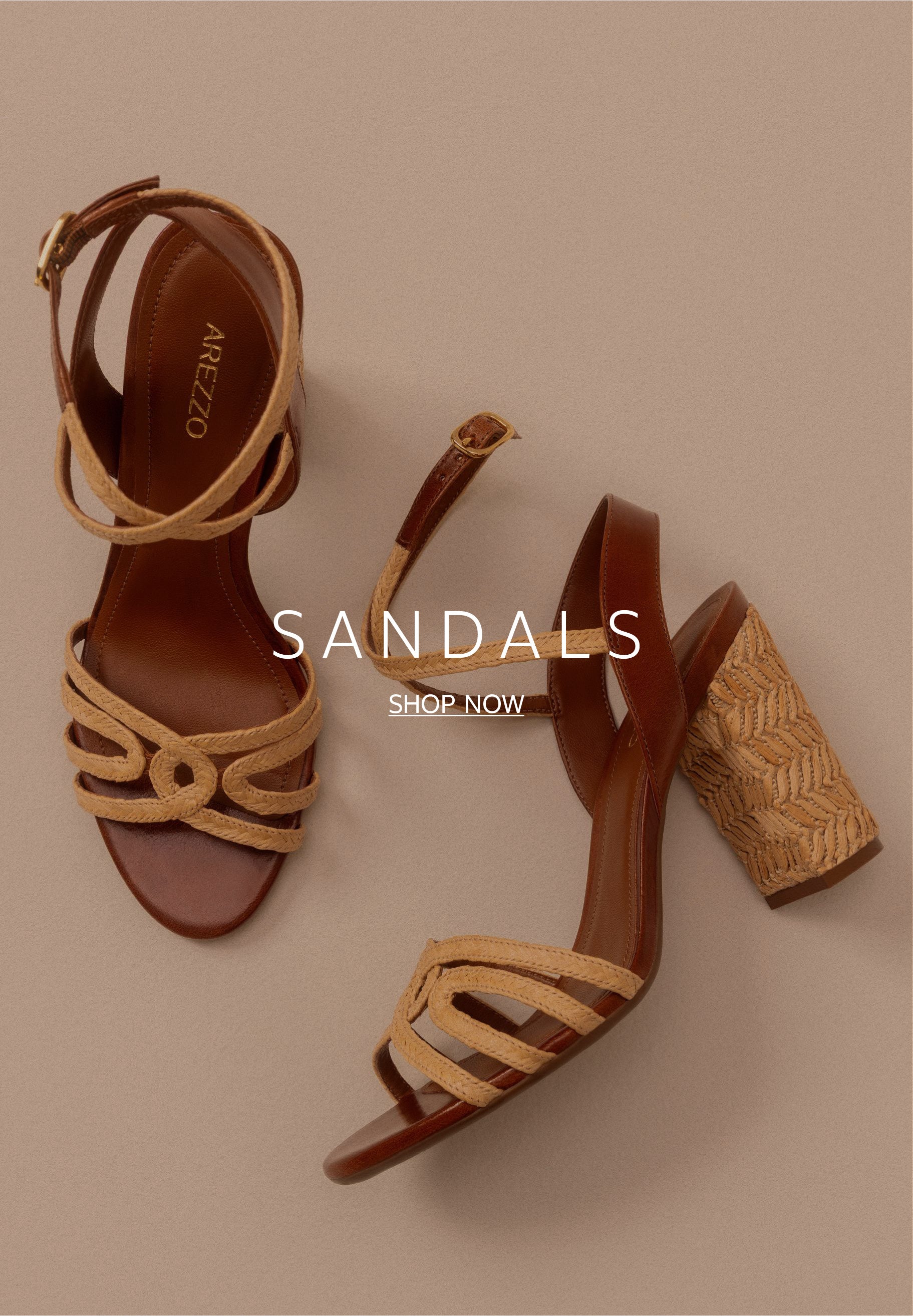 Overhead and side profile view of a pair of high-heeled sandals featuring brown leather insoles, woven beige straw front straps, and a thick block heel wrapped in matching woven straw.
